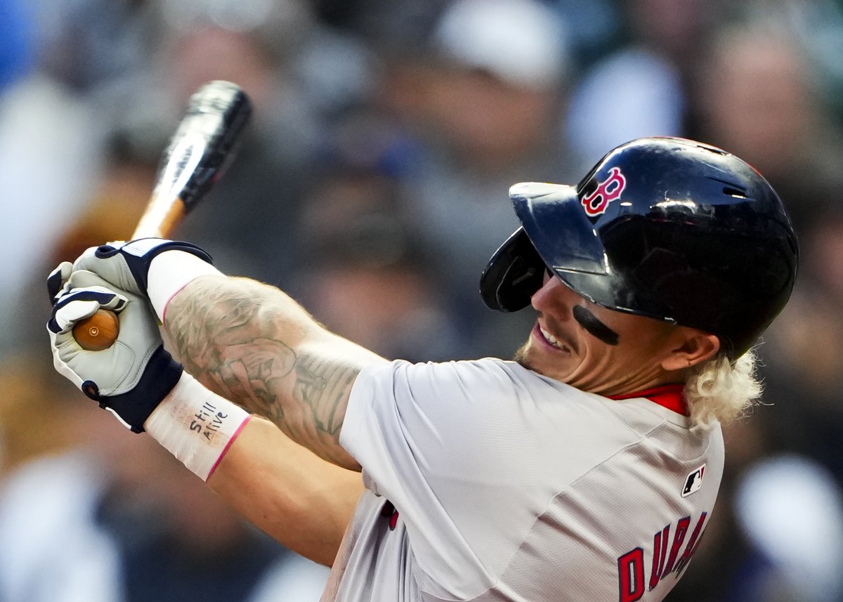 Baseball player at the plate with a handwritten reminder on his wrist tape