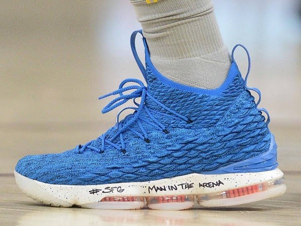 Basketball shoe with 'Man in the Arena' handwritten on the sole